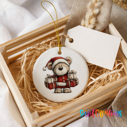 teddy bear dressed as Santa carrying Christmas gifts ceramic Christmas ornament displayed in a wooden gift crate