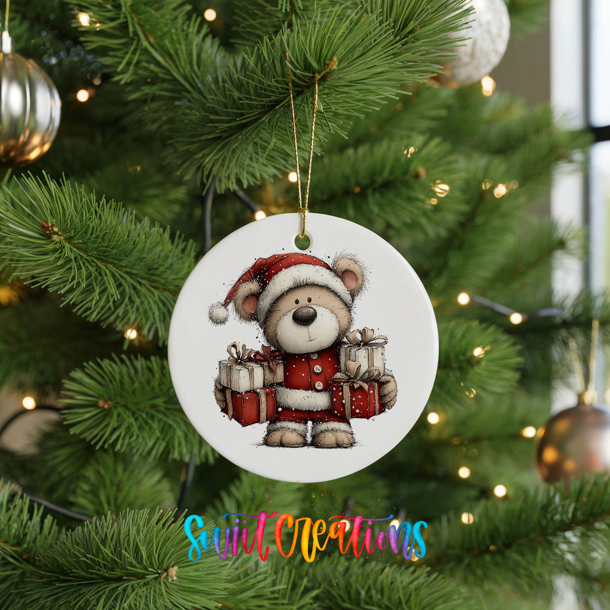 teddy bear dressed as Santa carrying Christmas gifts ceramic Christmas ornament hanging on a lit Christmas tree