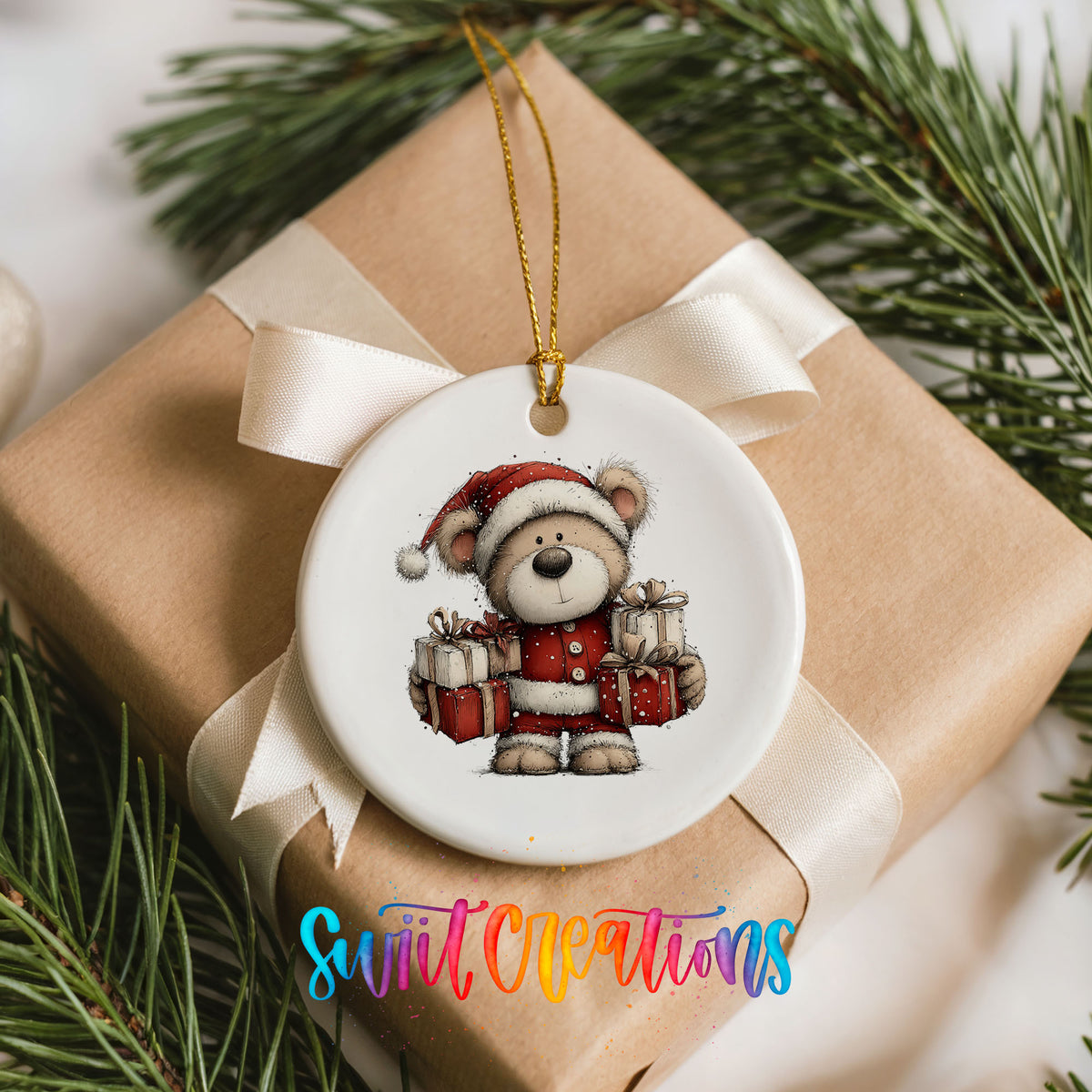 teddy bear dressed as Santa carrying Christmas gifts ceramic Christmas ornament displayed on a wrapped Christmas gift