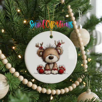 reindeer teddy bear with red Christmas ornaments ceramic Christmas ornament hanging on a green Christmas tree