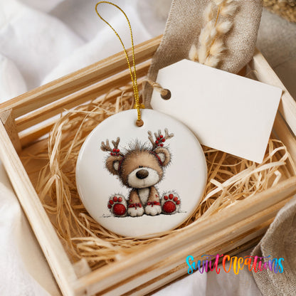 reindeer teddy bear with red Christmas ornaments ceramic Christmas ornament displayed in a wooden gift crate