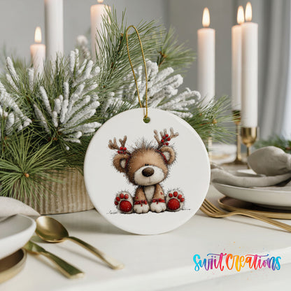 reindeer teddy bear with red Christmas ornaments ceramic Christmas ornament shown in a holiday table setting