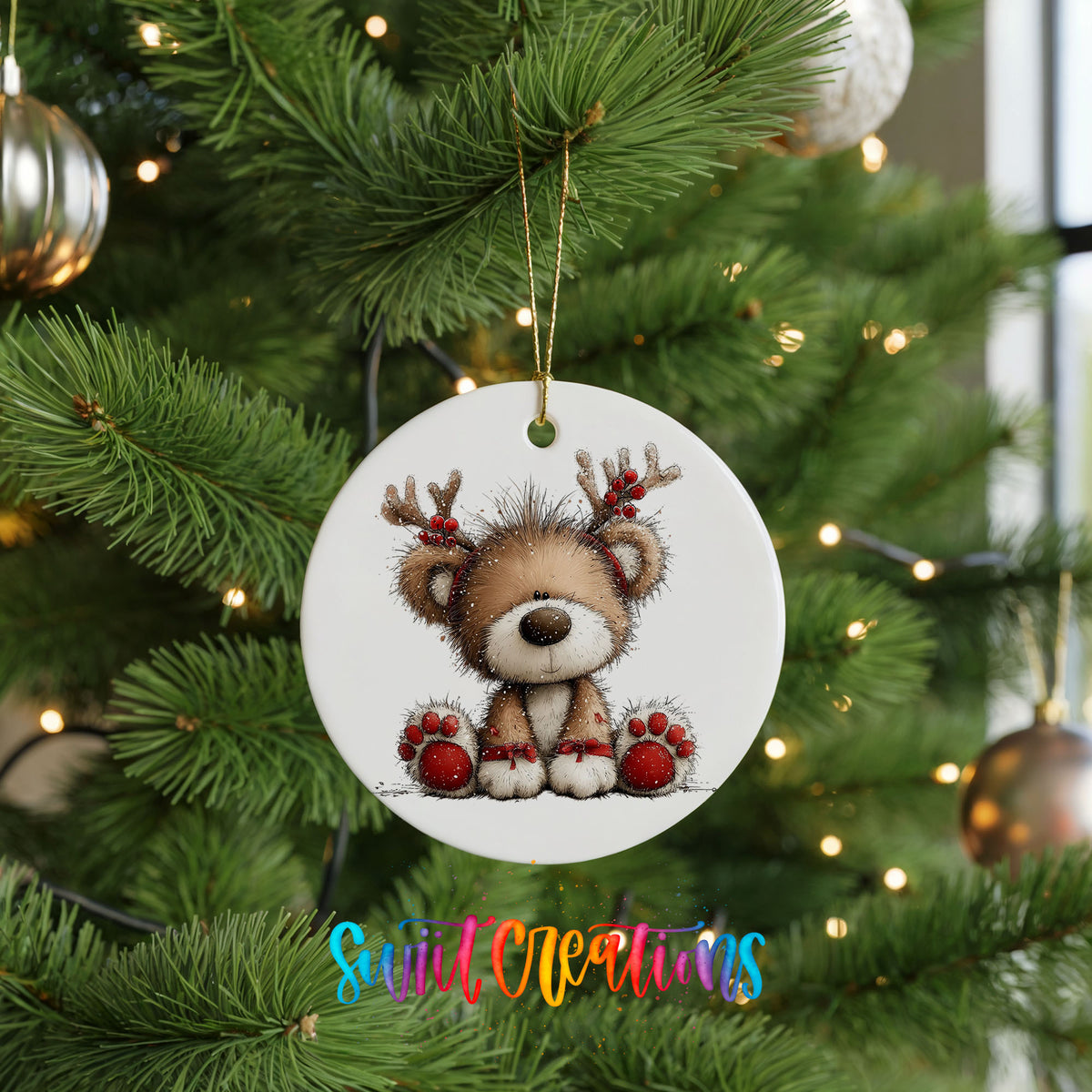 reindeer teddy bear with red Christmas ornaments ceramic Christmas ornament hanging on a lit Christmas tree
