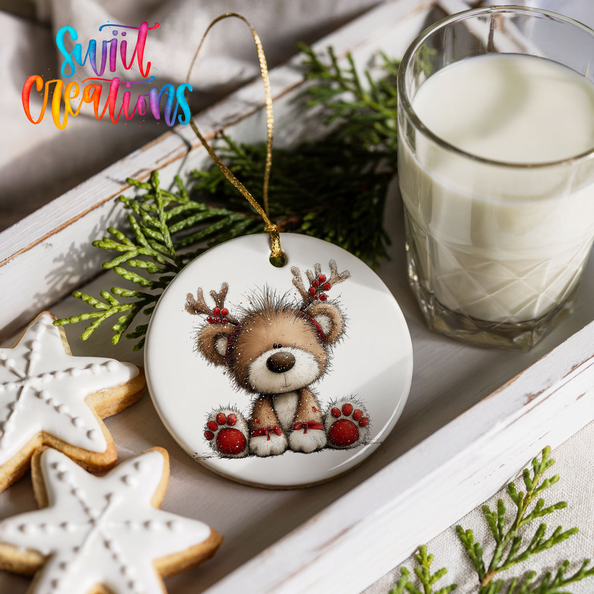 reindeer teddy bear with red Christmas ornaments ceramic Christmas ornament styled with holiday cookies and a candle