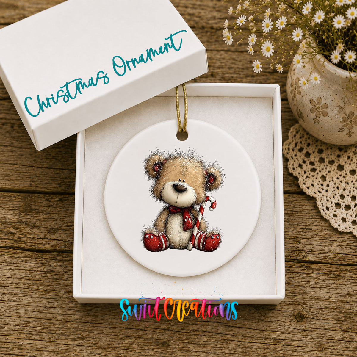 teddy bear with a candy cane and red Christmas ornament ceramic Christmas ornament presented in a gift box