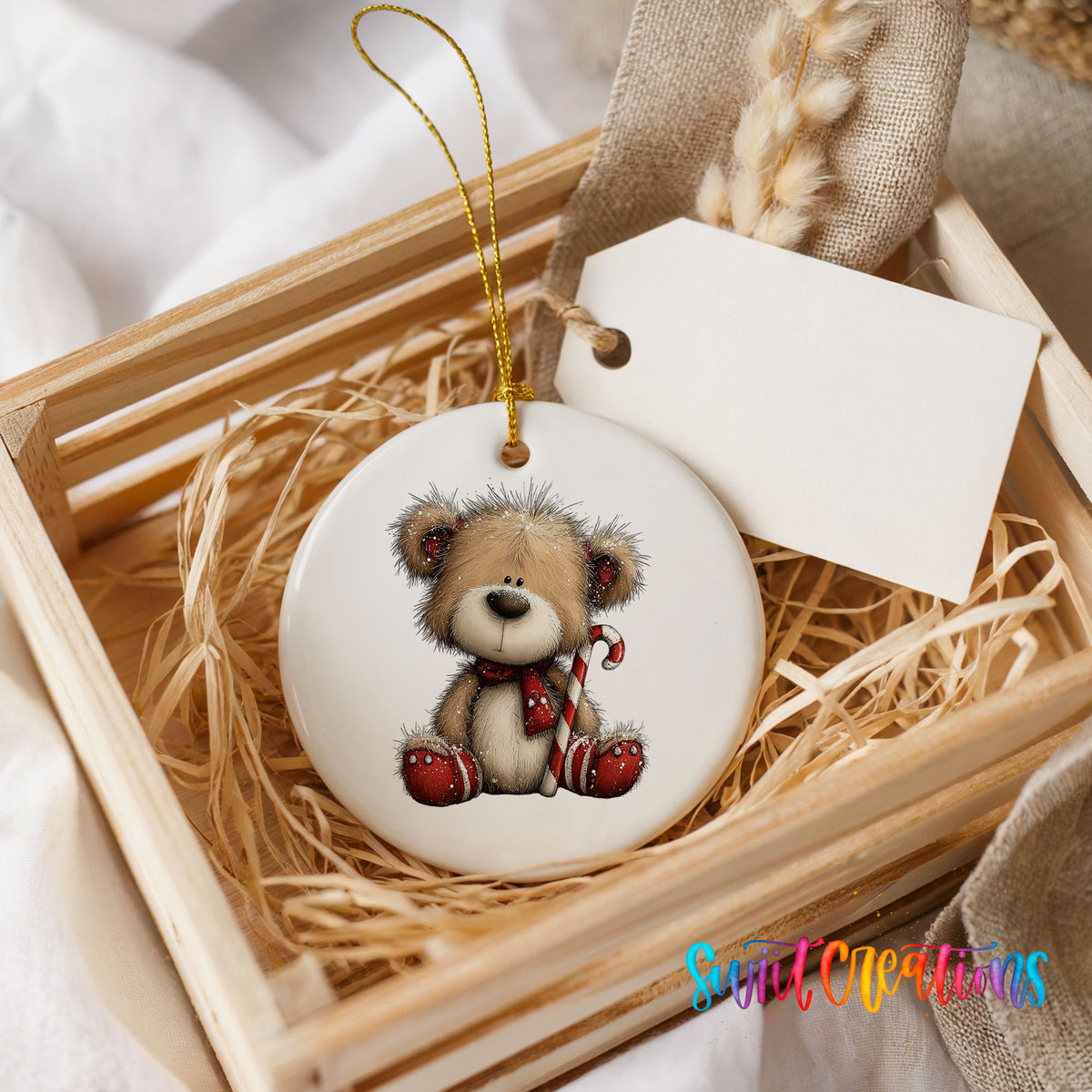 teddy bear with a candy cane and red Christmas ornament ceramic Christmas ornament displayed in a wooden gift crate