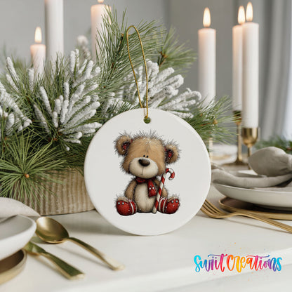 teddy bear with a candy cane and red Christmas ornament ceramic Christmas ornament shown in a holiday table setting