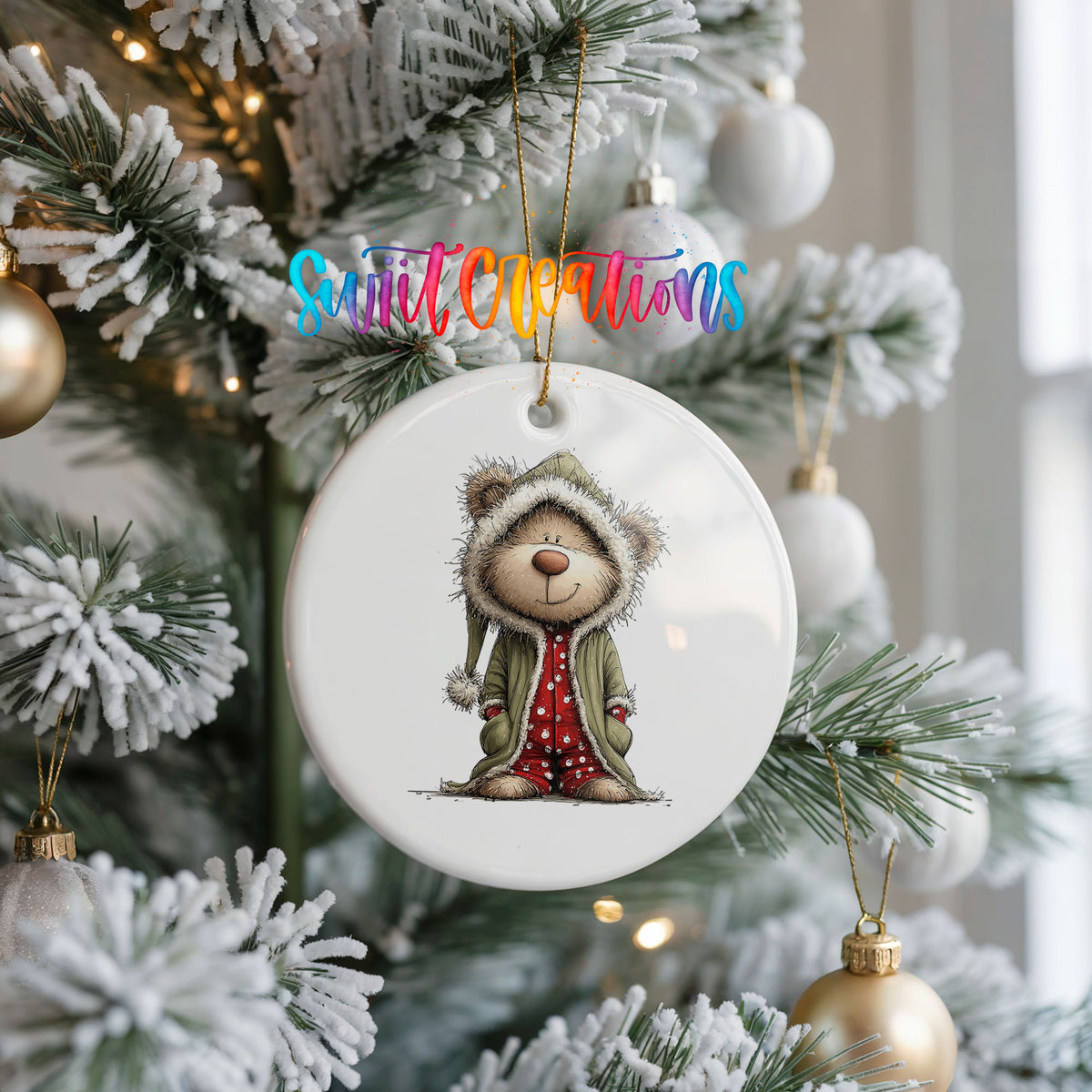 teddy bear in a gray hooded winter coat ceramic Christmas ornament hanging on a frosted Christmas tree