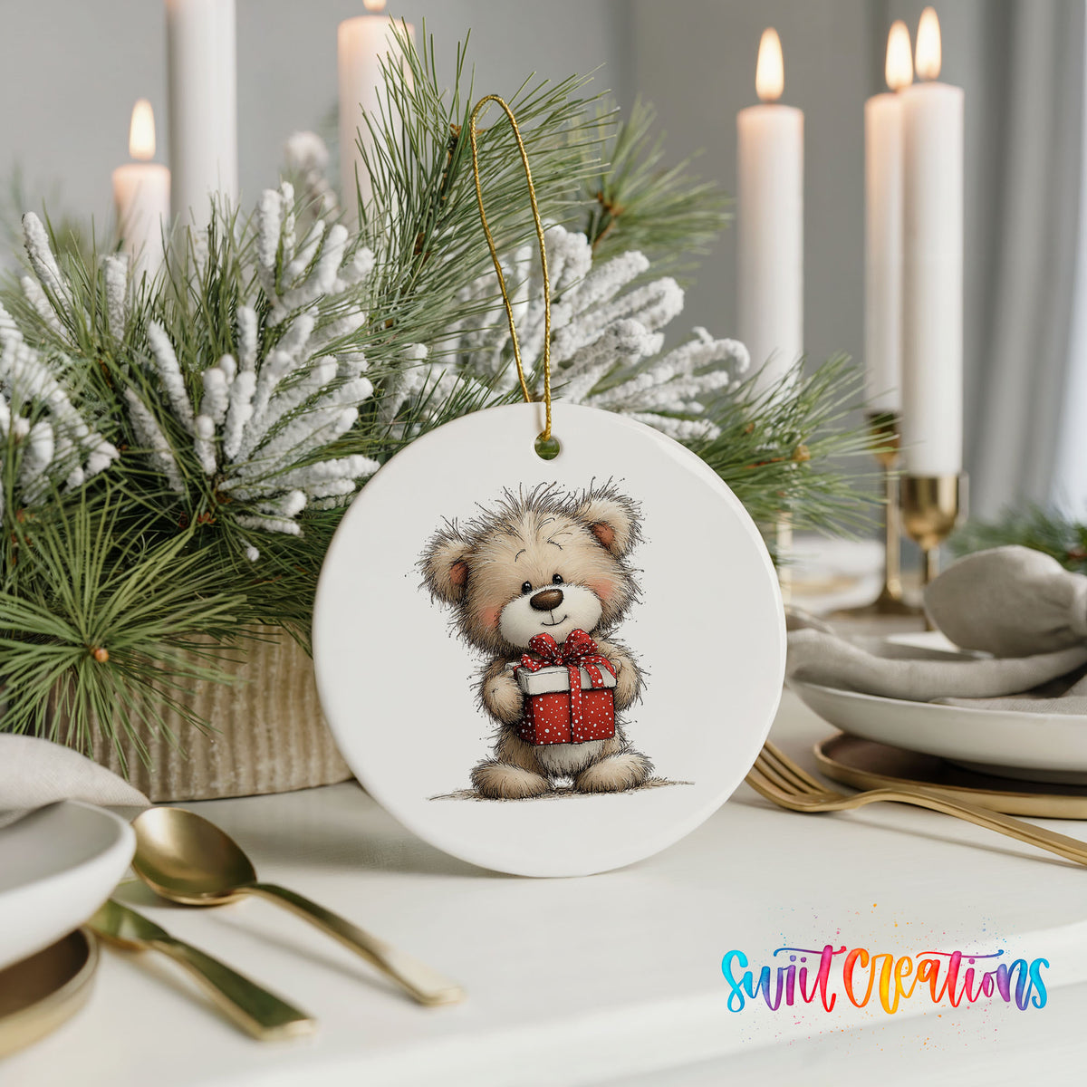 teddy bear holding a red Christmas gift ceramic Christmas ornament shown in a holiday table setting