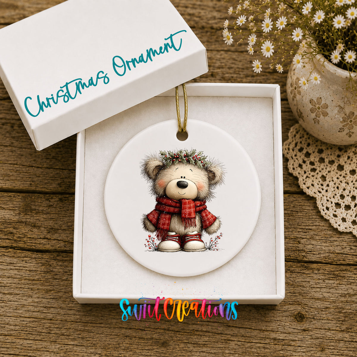 teddy bear in a red plaid scarf with holly ceramic Christmas ornament presented in a gift box