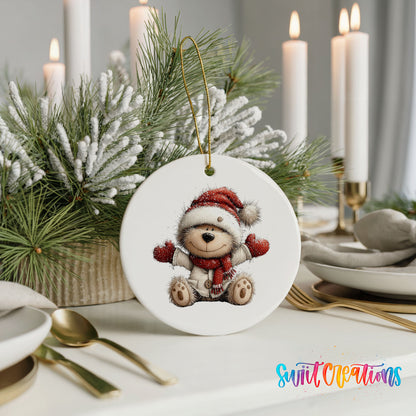 seated teddy bear in a Santa hat and red scarf ceramic Christmas ornament shown in a holiday table setting