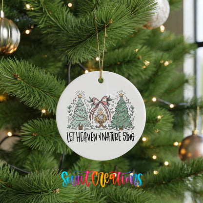 Let Heaven and Nature Sing church and winter trees design ceramic Christmas ornament hanging on a lit Christmas tree