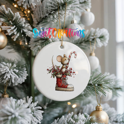woodland mouse with a candy cane in a Christmas stocking ceramic Christmas ornament hanging on a frosted Christmas tree