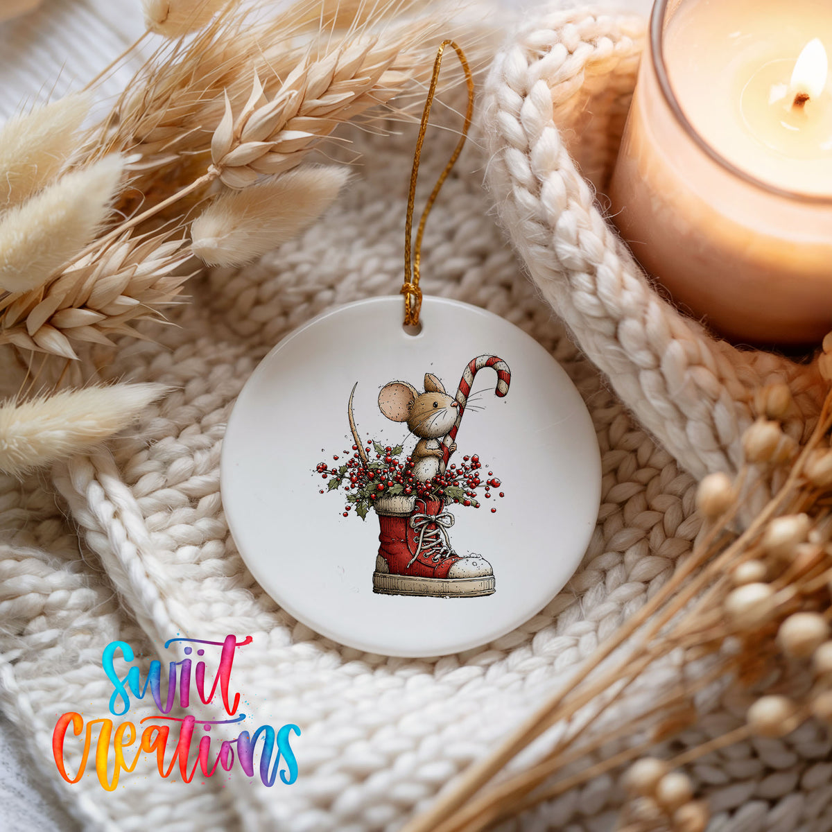 woodland mouse with a candy cane in a Christmas stocking ceramic Christmas ornament styled on a cozy knit blanket