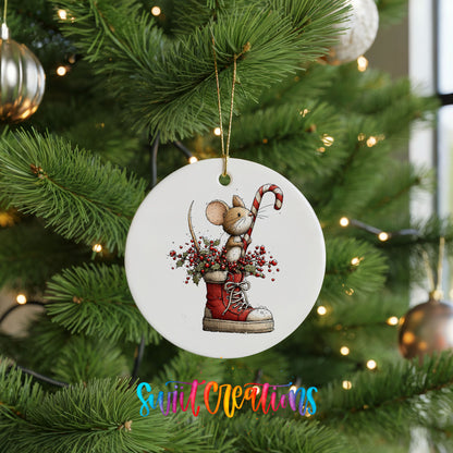 woodland mouse with a candy cane in a Christmas stocking ceramic Christmas ornament hanging on a lit Christmas tree
