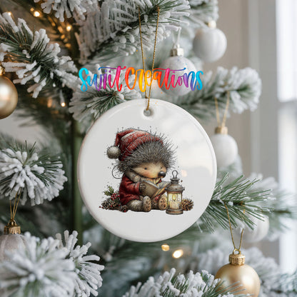 woodland bear in a Santa hat holding a lantern ceramic Christmas ornament hanging on a frosted Christmas tree