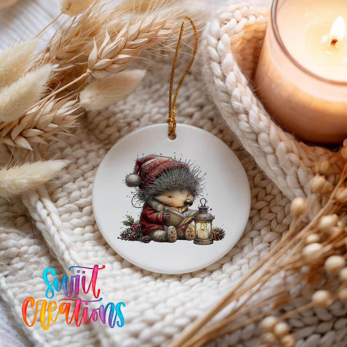 woodland bear in a Santa hat holding a lantern ceramic Christmas ornament styled on a cozy knit blanket