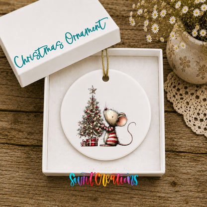 woodland mouse beside a decorated Christmas tree ceramic Christmas ornament presented in a gift box