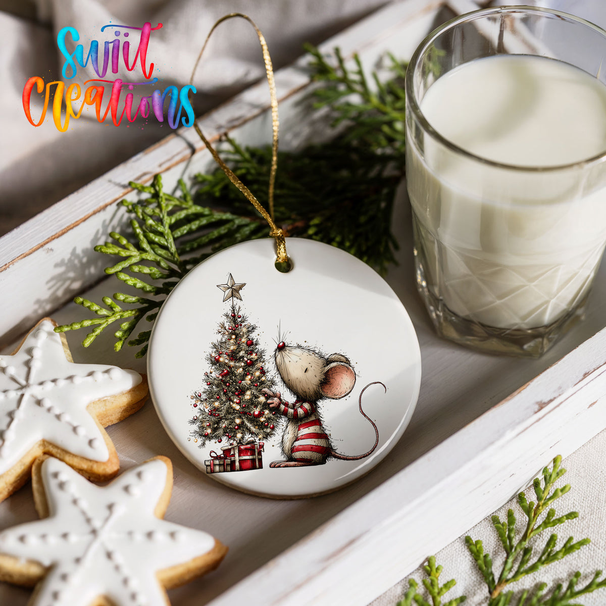 woodland mouse beside a decorated Christmas tree ceramic Christmas ornament styled with holiday cookies and a candle