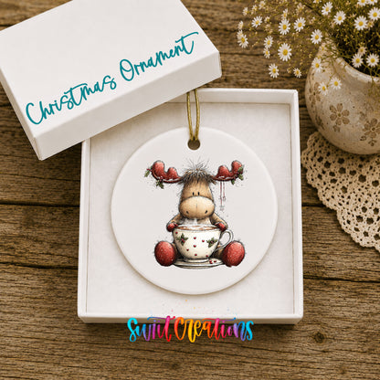 woodland moose in a snowman sweater ceramic Christmas ornament presented in a gift box