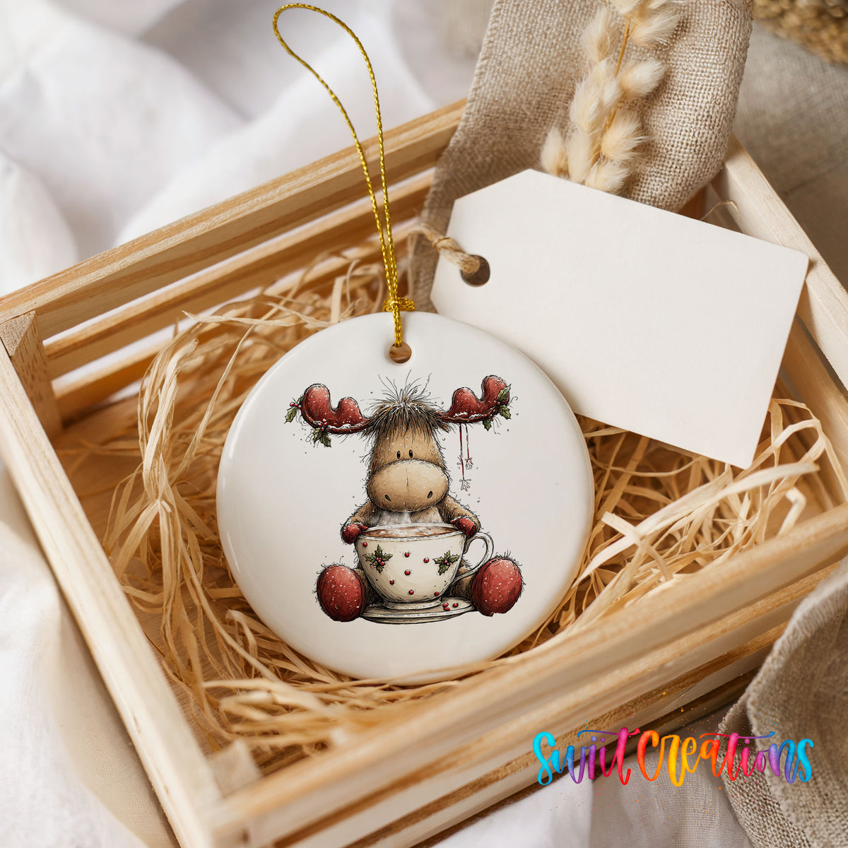 woodland moose in a snowman sweater ceramic Christmas ornament displayed in a wooden gift crate