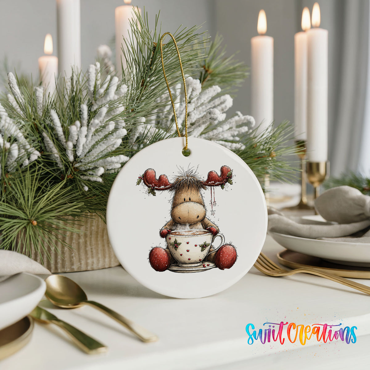 woodland moose in a snowman sweater ceramic Christmas ornament shown in a holiday table setting