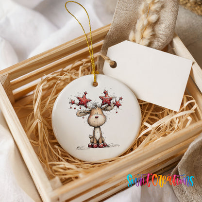 woodland reindeer with red stars on its antlers ceramic Christmas ornament displayed in a wooden gift crate