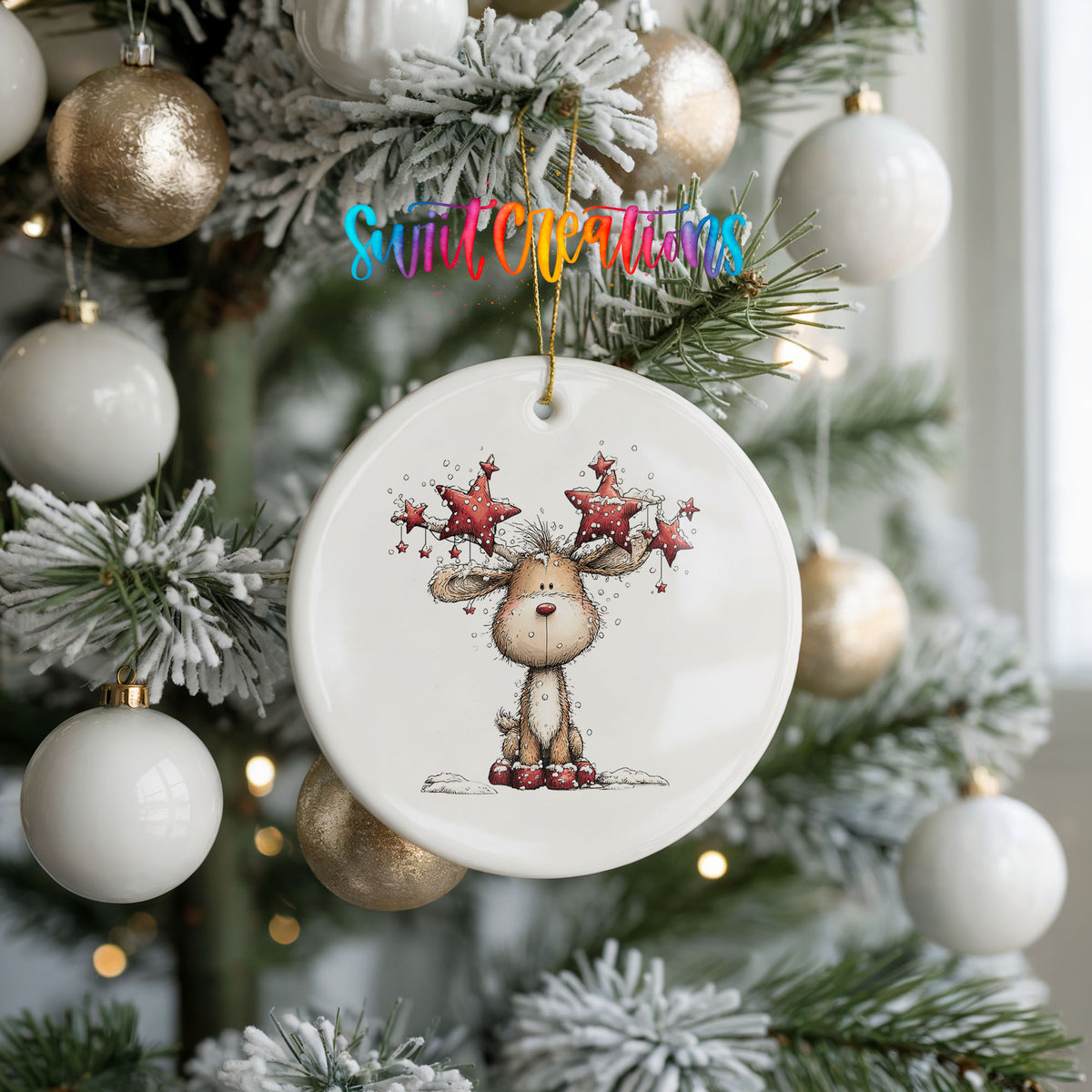 woodland reindeer with red stars on its antlers ceramic Christmas ornament hanging on a frosted tree with ornaments