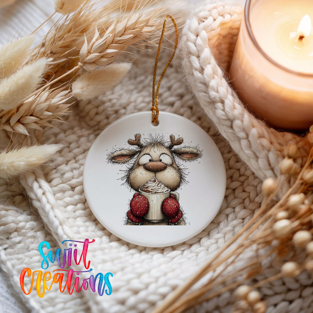 woodland reindeer wearing red mittens ceramic Christmas ornament styled on a cozy knit blanket