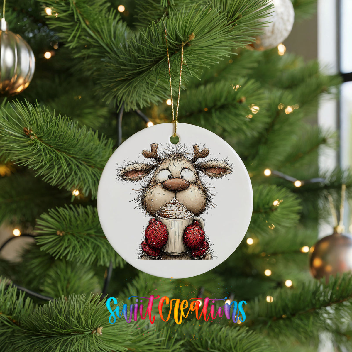 woodland reindeer wearing red mittens ceramic Christmas ornament hanging on a lit Christmas tree