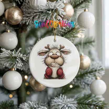 woodland reindeer wearing red mittens ceramic Christmas ornament hanging on a frosted tree with ornaments