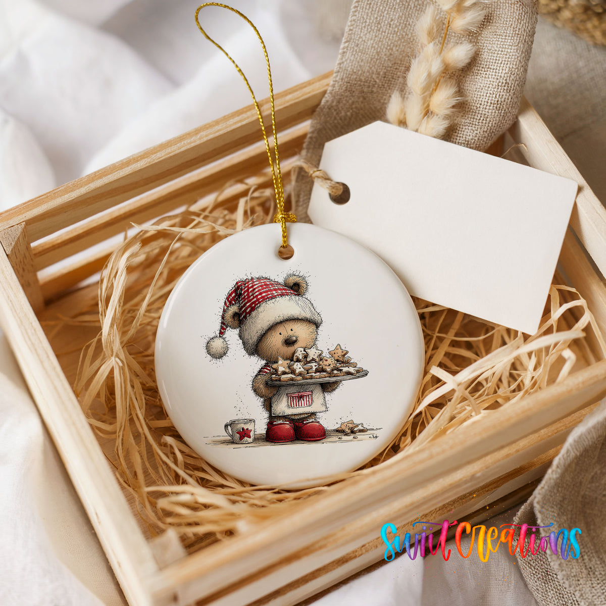 woodland bear in a Santa hat carrying Christmas cookies ceramic Christmas ornament displayed in a wooden gift crate