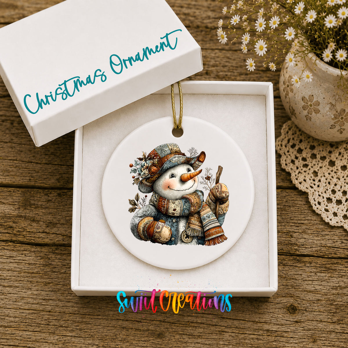 snowman in a brown hat with a winter walking stick ceramic Christmas ornament presented in a gift box