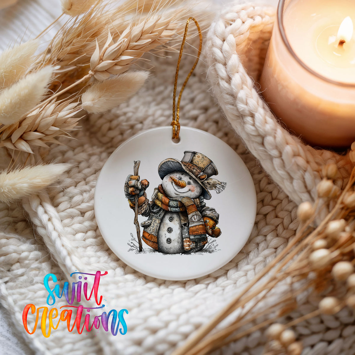 rustic snowman in a top hat carrying a walking stick ceramic Christmas ornament styled on a cozy knit blanket