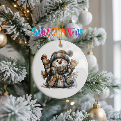 cheerful snowman raising striped winter mittens ceramic Christmas ornament hanging on a frosted Christmas tree