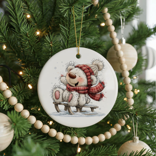Polar Bear Playing in the Snow ceramic Christmas ornament, front view