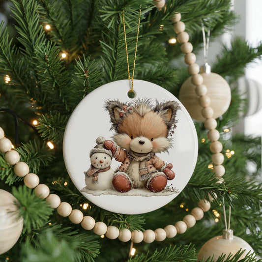 Winter Fox Cuddling a Snowman ceramic Christmas ornament, front view