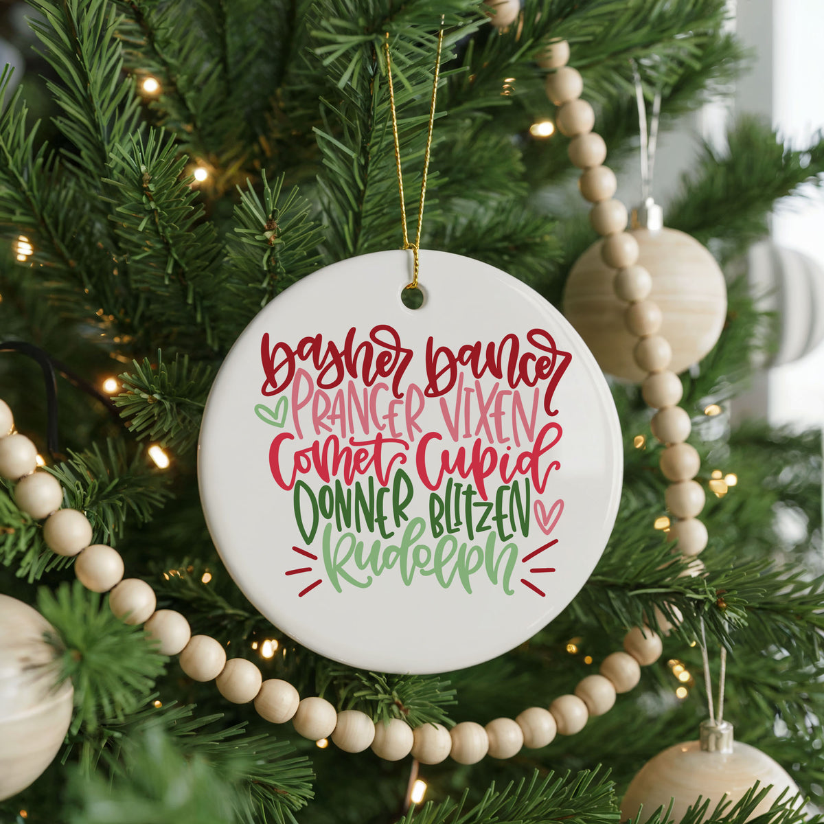 Colorful Reindeer Names ceramic Christmas ornament, front view