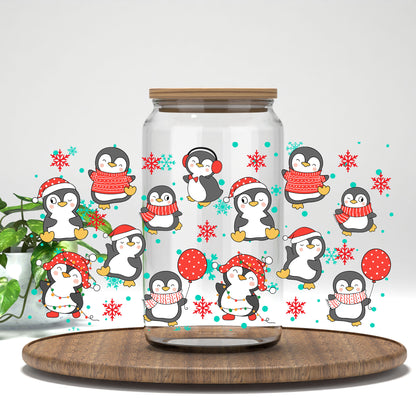 Christmas Penguins UV DTF wrap on a clear glass can