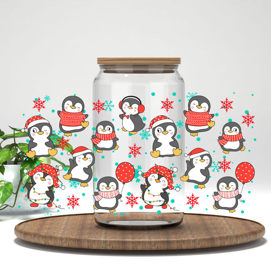 Christmas Penguins UV DTF wrap on a clear glass can