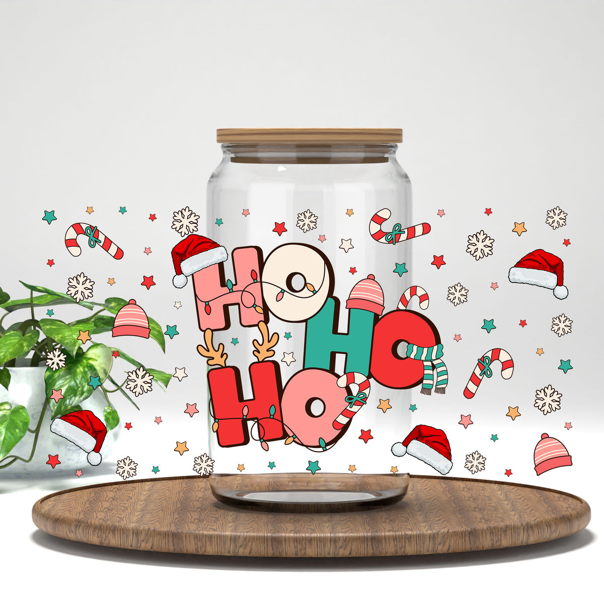Ho Ho Ho Santa Hats UV DTF wrap on a clear glass can