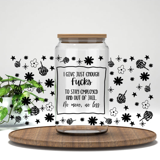 I Give Just Enough F*cks black skeleton hands and flowers UV DTF full wrap on a clear glass can