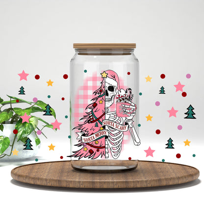 Sorta Merry Sorta Scary pink tree skeleton UV DTF wrap on a clear glass can