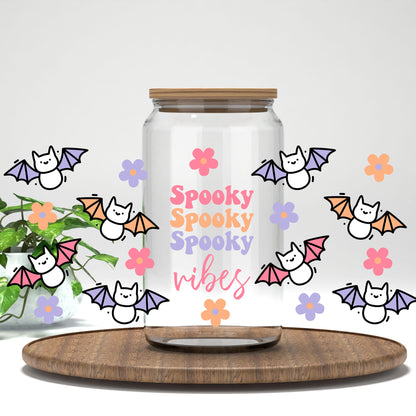 Spooky Vibes pastel bats and daisies UV DTF full wrap on a clear glass can