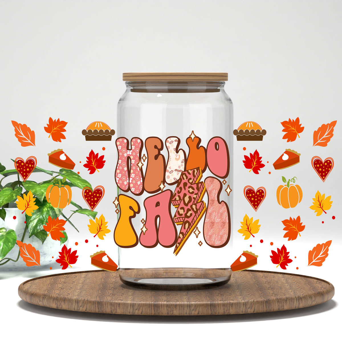 Hello Fall leopard letters, pies, and pumpkins UV DTF full wrap on a clear glass can