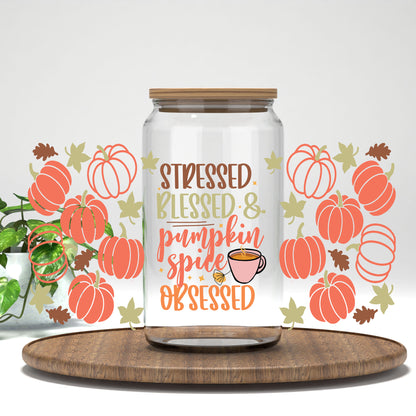 Stressed Blessed and Pumpkin Spice Obsessed UV DTF wrap on a clear glass can