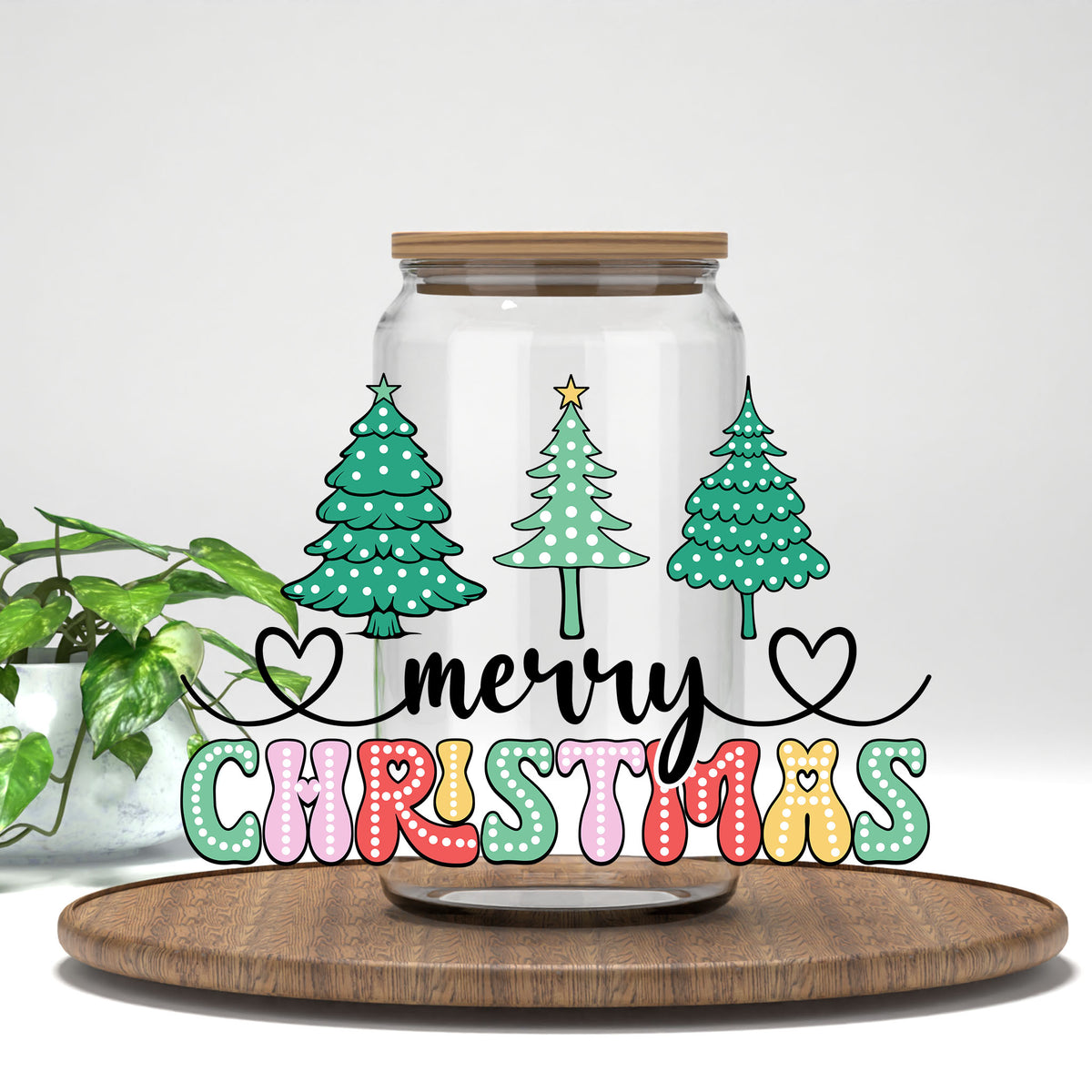 Merry Christmas Polka Dot Trees UV DTF wrap on a clear glass can
