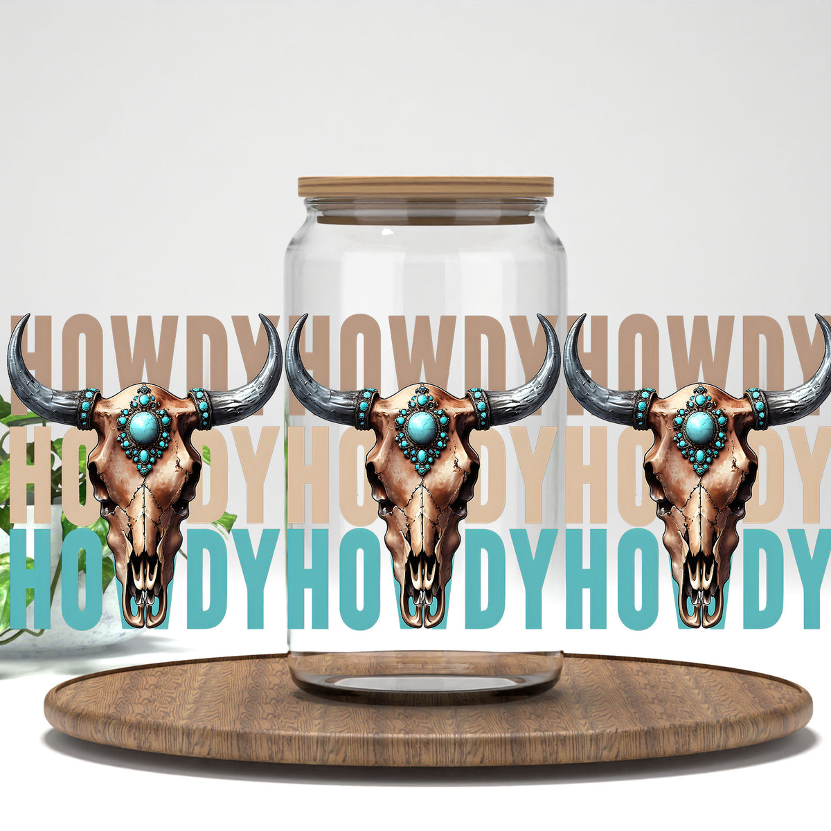 Howdy turquoise bull skulls UV DTF full wrap on a clear glass can