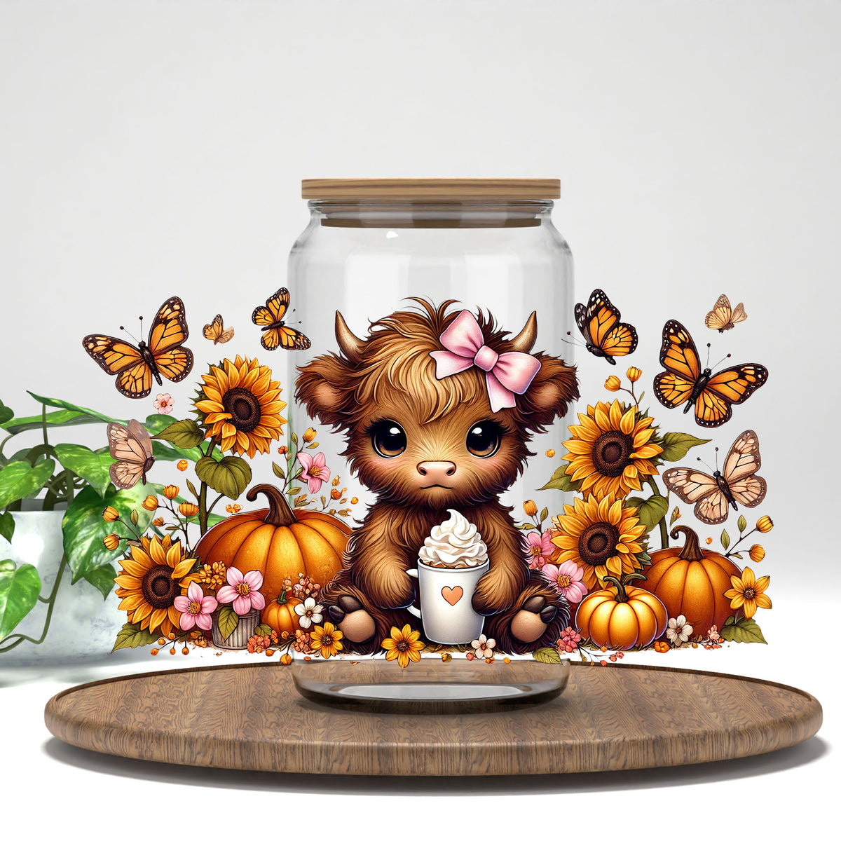 Fall Highland Cow UV DTF wrap on a clear glass can