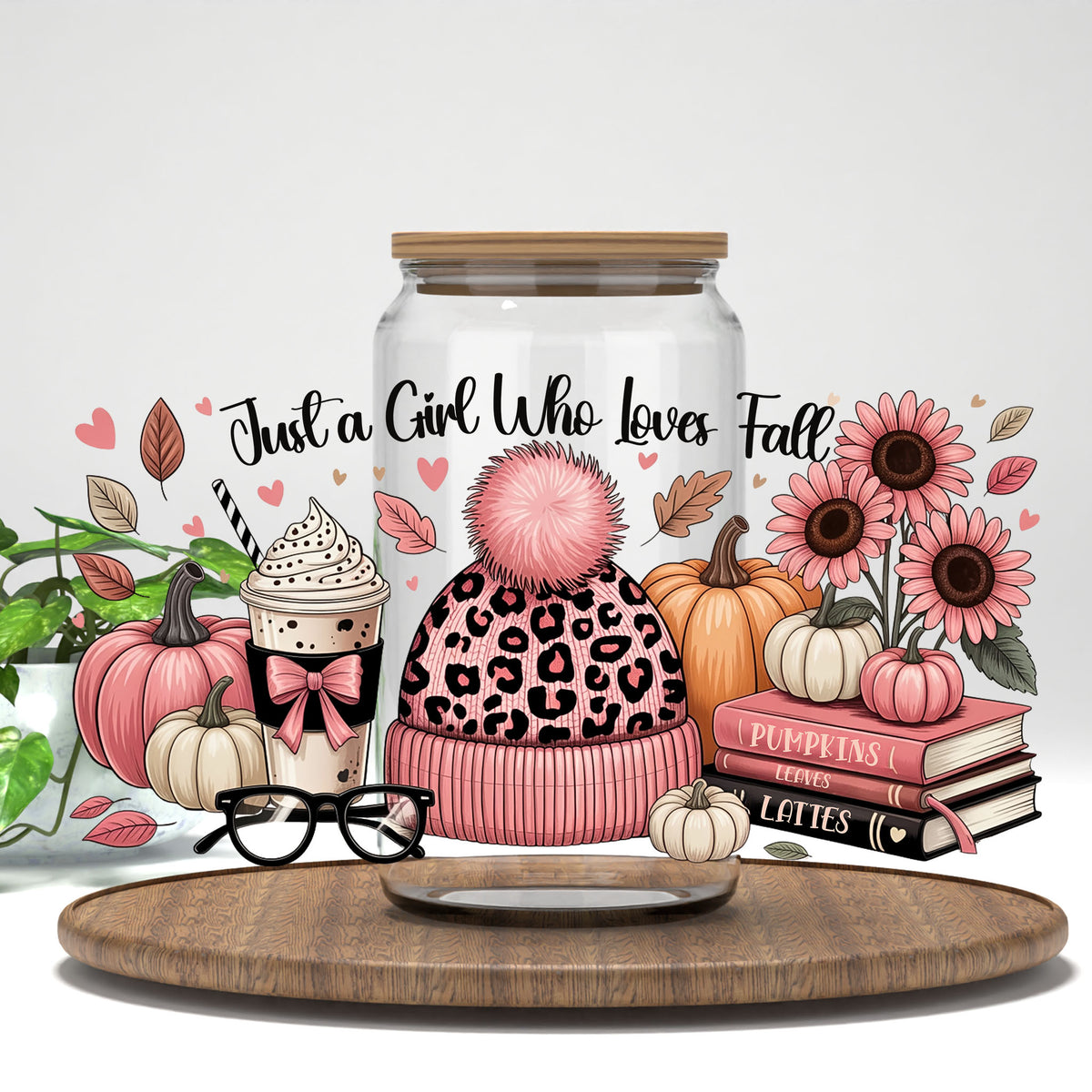 Just a Girl Who Loves Fall pink leopard beanie and books UV DTF wrap on a clear glass can